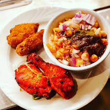 New Delhi Indian Restaurant signature dishes Tandoori ChickenLamb SaagVegetable Samosas
